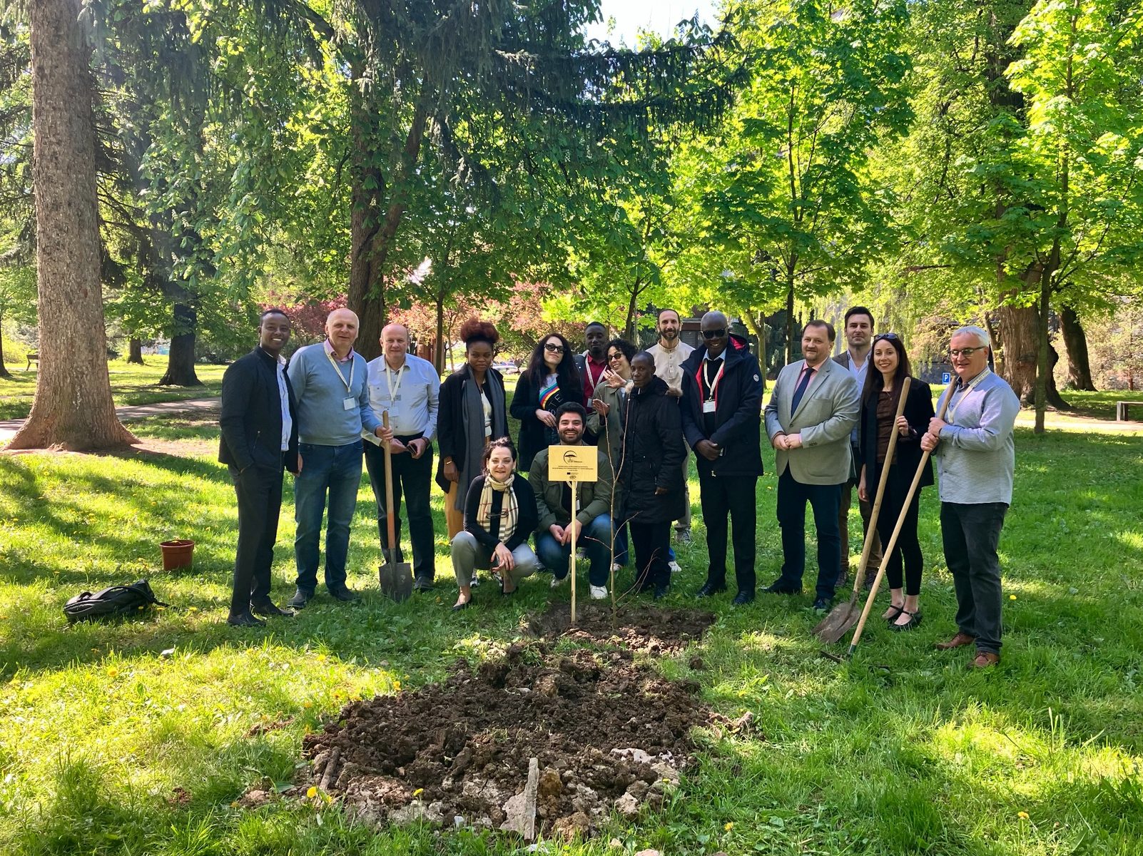 FORestore project partners gathered around a newly planted tree